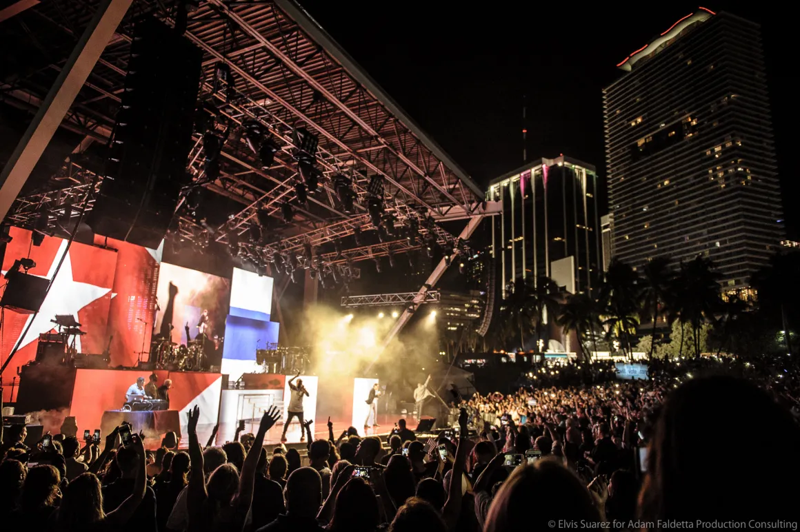 AFPC live concert production with stage lighting and audience