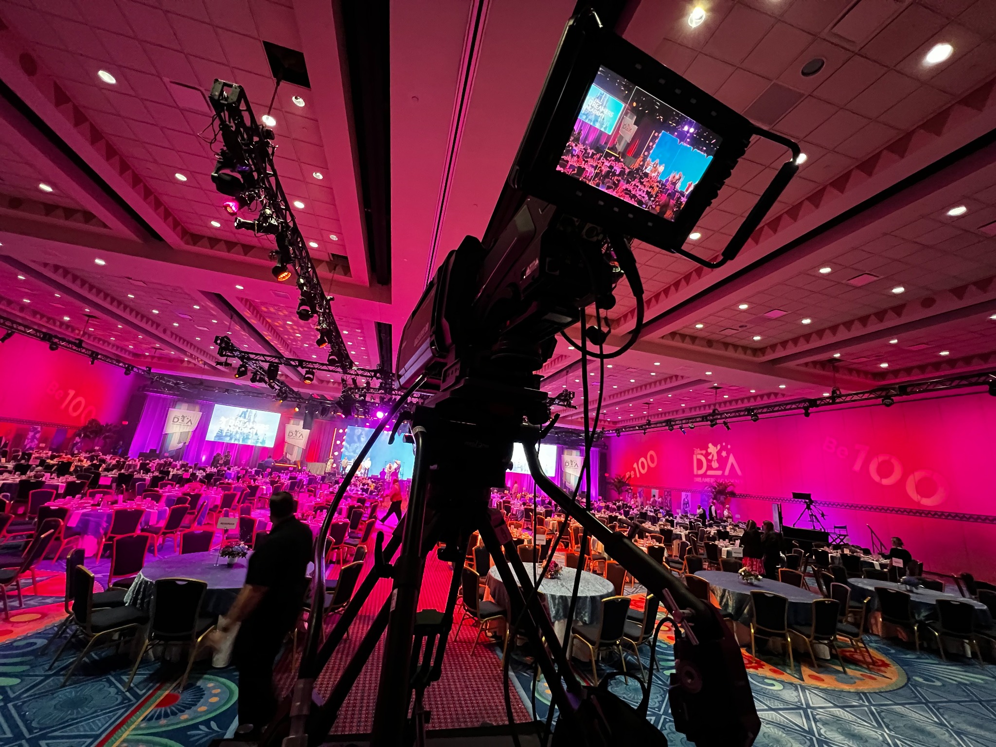 Broadcast camera in a ballroom event production setting