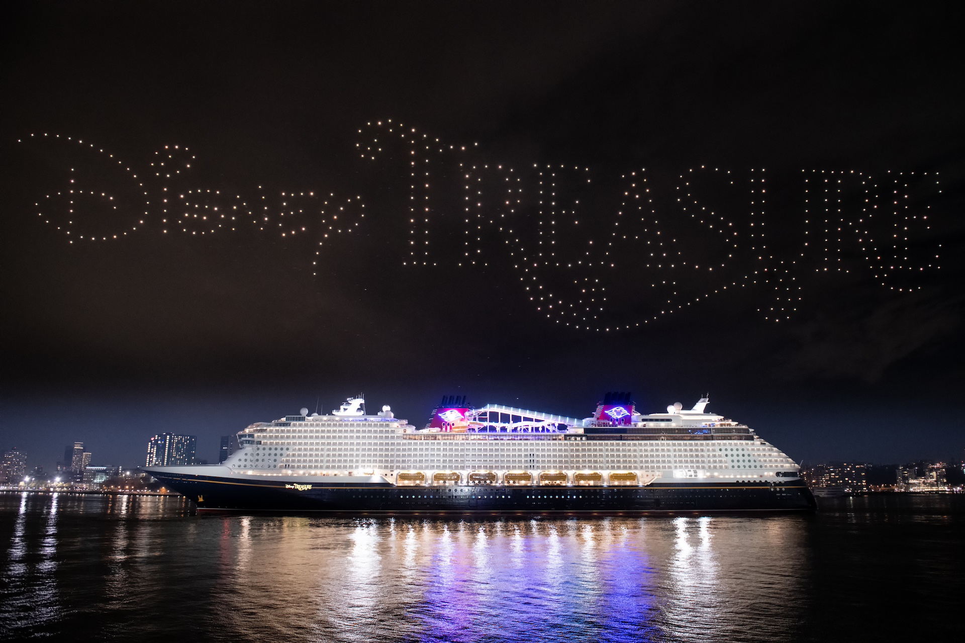 Disney Treasure cruise ship with drone show over the harbor